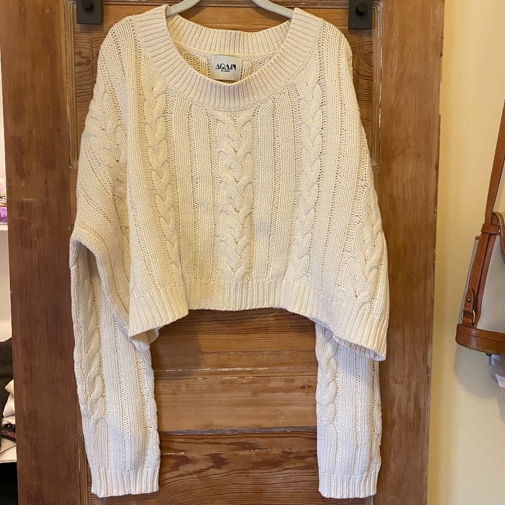 White cable-knit off the shoulder sweater